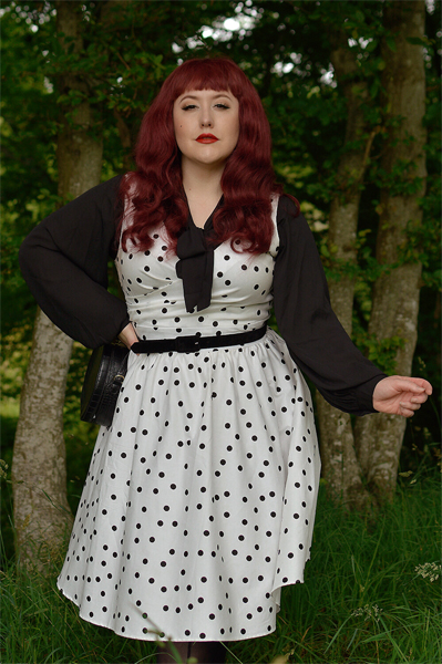 Plus size pinup Miss Amy May models the Polka Dot May crossover bust swing dress gifted by Dolly & Dotty for a fit and size review