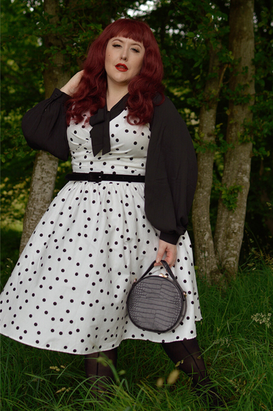 Plus size pinup Miss Amy May models the Polka Dot May crossover bust swing dress gifted by Dolly & Dotty for a fit and size review