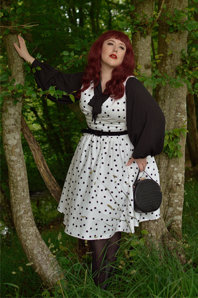 Plus size pinup Miss Amy May models the Polka Dot May crossover bust swing dress gifted by Dolly & Dotty for a fit and size review