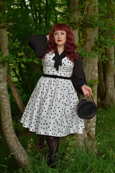 Plus size pinup Miss Amy May models the Polka Dot May crossover bust swing dress gifted by Dolly & Dotty for a fit and size review