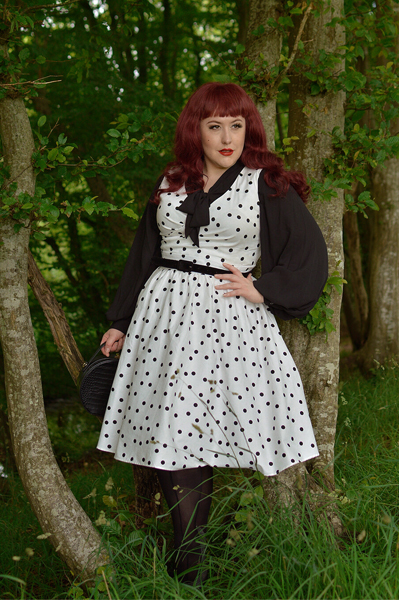 Plus size pinup Miss Amy May models the Polka Dot May crossover bust swing dress gifted by Dolly & Dotty for a fit and size review