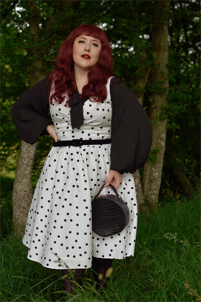 Plus size pinup Miss Amy May models the Polka Dot May crossover bust swing dress gifted by Dolly & Dotty for a fit and size review