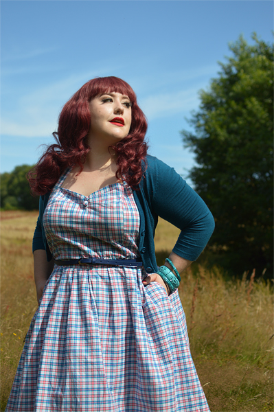 Plus size pinup Miss Amy May models the Sophia Halterneck pink and blue Check dress gifted by Dolly & Dotty for a fit and size review