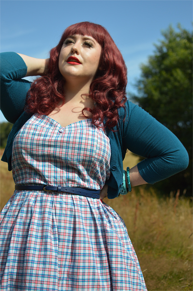 Plus size pinup Miss Amy May models the Sophia Halterneck pink and blue Check dress gifted by Dolly & Dotty for a fit and size review
