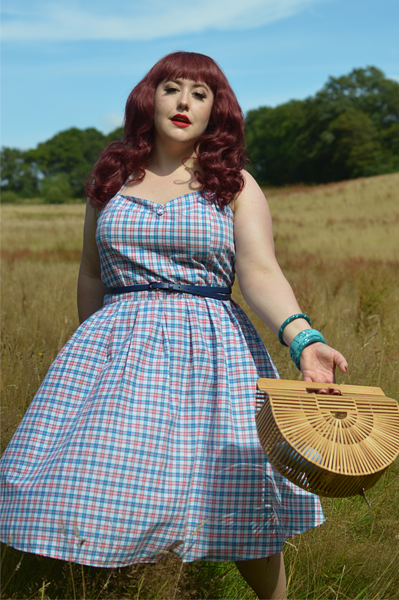 Plus size pinup Miss Amy May models the Sophia Halterneck pink and blue Check dress gifted by Dolly & Dotty for a fit and size review