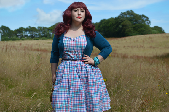 Plus size pinup Miss Amy May models the Sophia Halterneck pink and blue Check dress gifted by Dolly & Dotty for a fit and size review