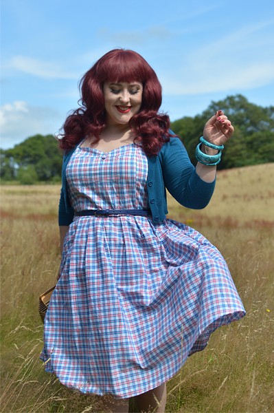Plus size pinup Miss Amy May models the Sophia Halterneck pink and blue Check dress gifted by Dolly & Dotty for a fit and size review