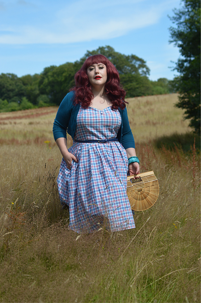 Plus size pinup Miss Amy May models the Sophia Halterneck pink and blue Check dress gifted by Dolly & Dotty for a fit and size review
