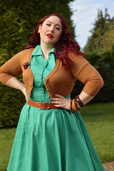 Plus size pinup Miss Amy May models the green Penelope shirt dress gifted by Dolly & Dotty for a fit and size review