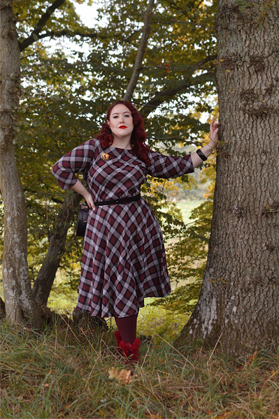Plus size pinup Miss Amy May models the burgundy and grey plaid Devon swing dress for a fit and sizing review