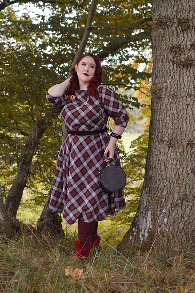 Plus size pinup Miss Amy May models the burgundy and grey plaid Devon swing dress for a fit and sizing review