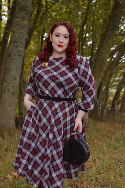 Plus size pinup Miss Amy May models the burgundy and grey plaid Devon swing dress for a fit and sizing review
