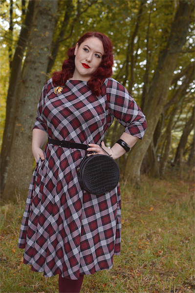 Plus size pinup Miss Amy May models the burgundy and grey plaid Devon swing dress for a fit and sizing review