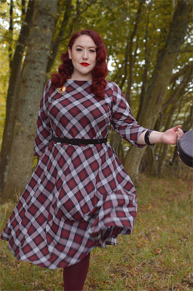 Plus size pinup Miss Amy May models the burgundy and grey plaid Devon swing dress for a fit and sizing review