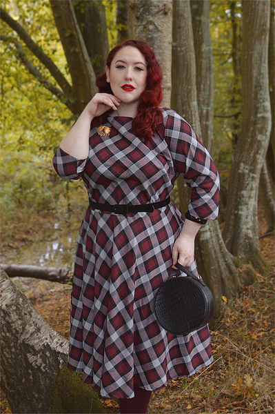 Plus size pinup Miss Amy May models the burgundy and grey plaid Devon swing dress for a fit and sizing review