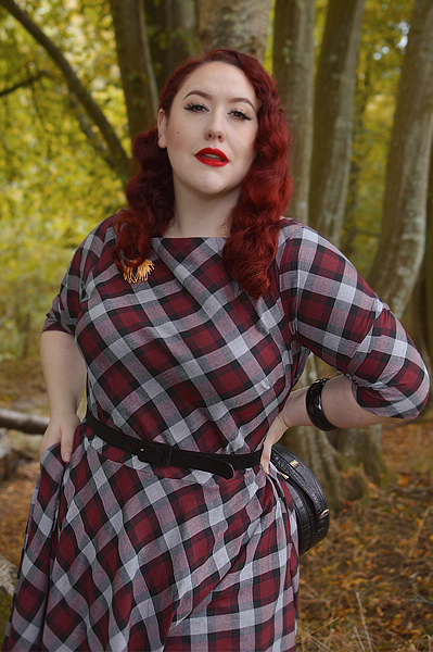 Plus size pinup Miss Amy May models the burgundy and grey plaid Devon swing dress for a fit and sizing review