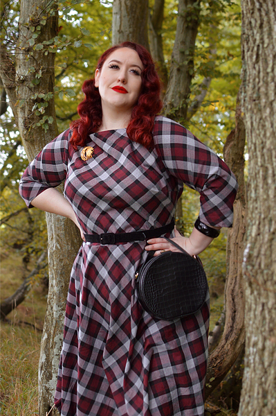 Plus size pinup Miss Amy May models the burgundy and grey plaid Devon swing dress for a fit and sizing review