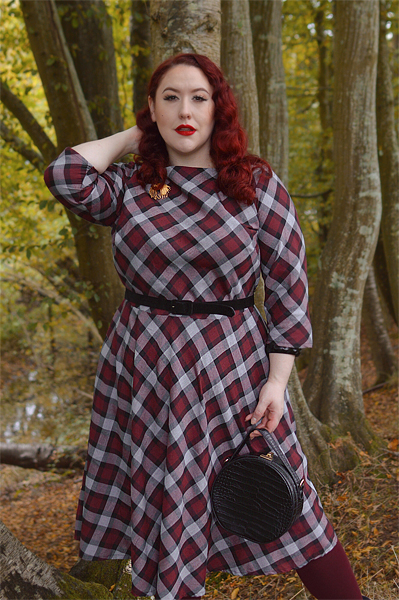 Plus size pinup Miss Amy May models the burgundy and grey plaid Devon swing dress for a fit and sizing review