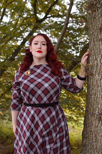 Plus size pinup Miss Amy May models the burgundy and grey plaid Devon swing dress for a fit and sizing review
