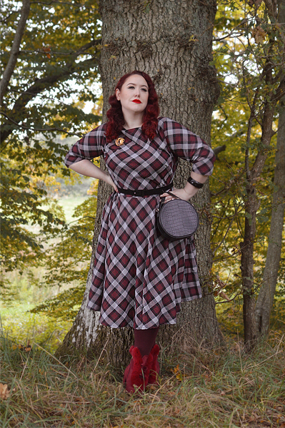 Plus size pinup Miss Amy May models the burgundy and grey plaid Devon swing dress for a fit and sizing review