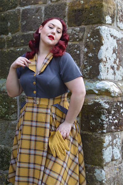 Plus size pinup Miss Amy May models the Isolde-Sun dress by Miss Candyfloss for a fit and size review