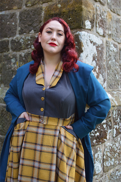 Plus size pinup Miss Amy May models the Isolde-Sun dress by Miss Candyfloss for a fit and size review