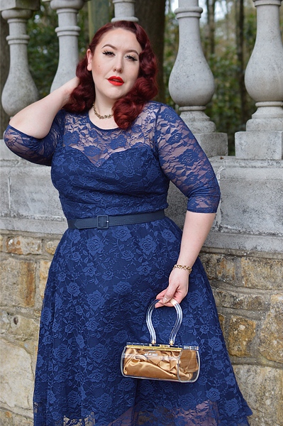 Plus size pinup Miss Amy May models the navy blue Madeline lace dress by Dolly and Dotty for a fit and size review