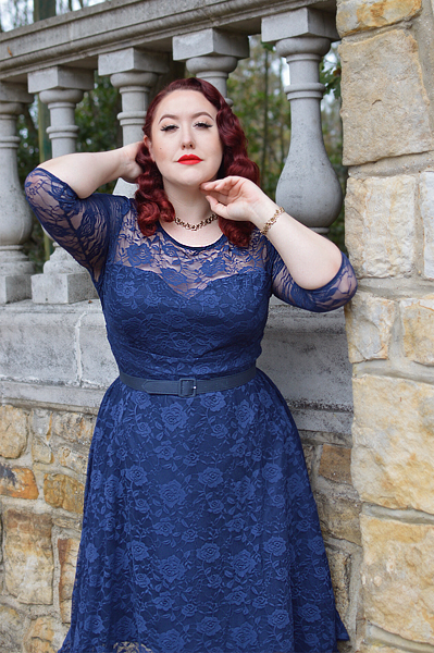 Plus size pinup Miss Amy May models the navy blue Madeline lace dress by Dolly and Dotty for a fit and size review