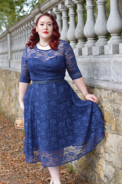 Plus size pinup Miss Amy May models the navy blue Madeline lace dress by Dolly and Dotty for a fit and size review