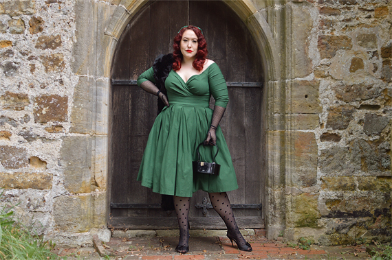 Plus size pinup Miss Amy May models the green Marceline dress by Unique Vintage for a fit and sizing review