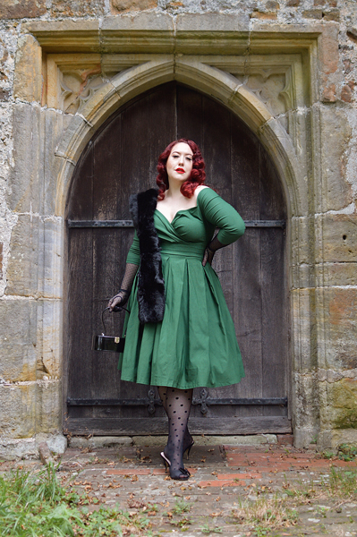 Plus size pinup Miss Amy May models the green Marceline dress by Unique Vintage for a fit and sizing review