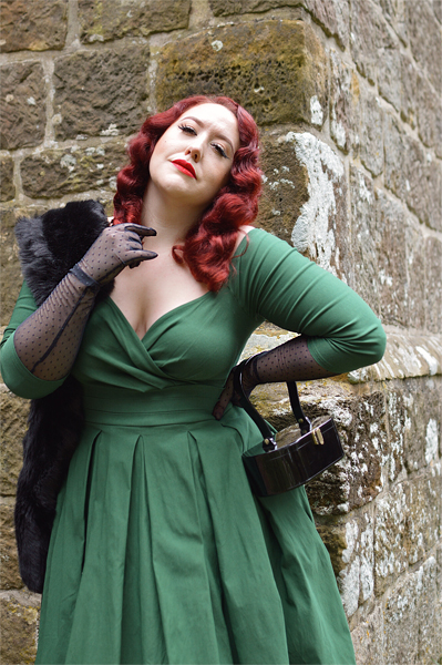 Plus size pinup Miss Amy May models the green Marceline dress by Unique Vintage for a fit and sizing review