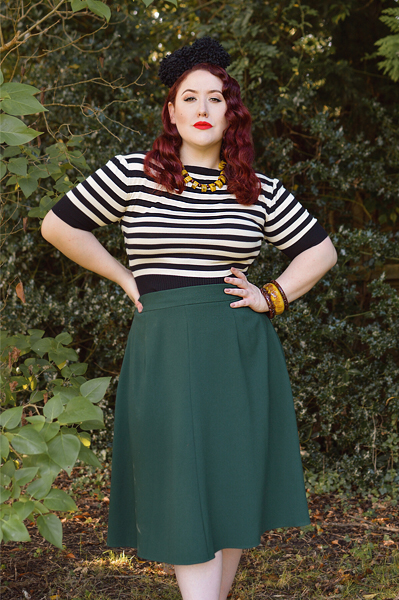 Plus size pinup Miss Amy May models the classic 1940s a-line skirt by Weekend Doll and the black and ivory striped Boatneck sweater by Pretty Retro for a fit and size review