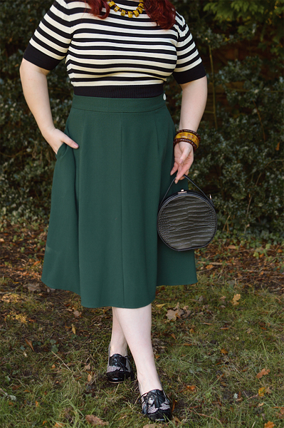 Plus size pinup Miss Amy May models the classic 1940s a-line skirt by Weekend Doll and the black and ivory striped Boatneck sweater by Pretty Retro for a fit and size review
