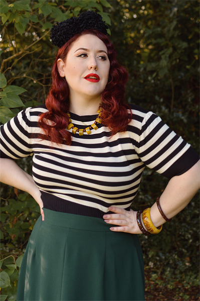Plus size pinup Miss Amy May models the classic 1940s a-line skirt by Weekend Doll and the black and ivory striped Boatneck sweater by Pretty Retro for a fit and size review