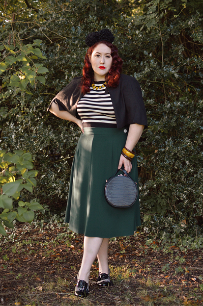 Plus size pinup Miss Amy May models the classic 1940s a-line skirt by Weekend Doll and the black and ivory striped Boatneck sweater by Pretty Retro for a fit and size review