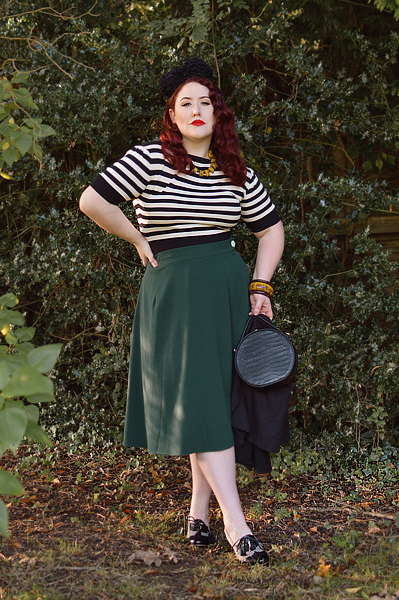 Plus size pinup Miss Amy May models the classic 1940s a-line skirt by Weekend Doll and the black and ivory striped Boatneck sweater by Pretty Retro for a fit and size review