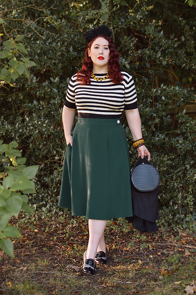 Plus size pinup Miss Amy May models the classic 1940s a-line skirt by Weekend Doll and the black and ivory striped Boatneck sweater by Pretty Retro for a fit and size review