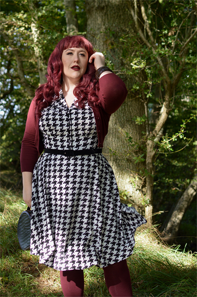Plus size pinup Miss Amy May models the Blake Mid dress by Hell Bunny for a fit and size review