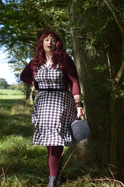 Plus size pinup Miss Amy May models the Blake Mid dress by Hell Bunny for a fit and size review