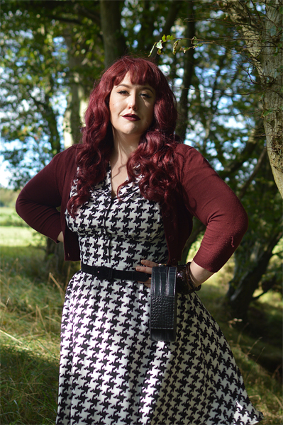 Plus size pinup Miss Amy May models the Blake Mid dress by Hell Bunny for a fit and size review