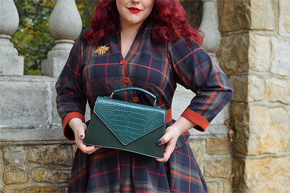 Pinup Miss Amy May models the Banned Retro Gemma faux croc vintage style handbag for review