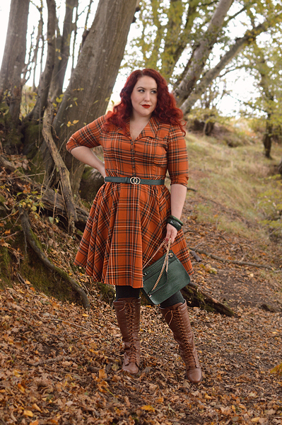 Plus size pinup Miss Amy May models the Tawny mid dress by Hell Bunny for a fit and sizing review