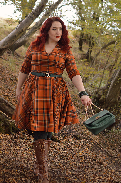 Plus size pinup Miss Amy May models the Tawny mid dress by Hell Bunny for a fit and sizing review