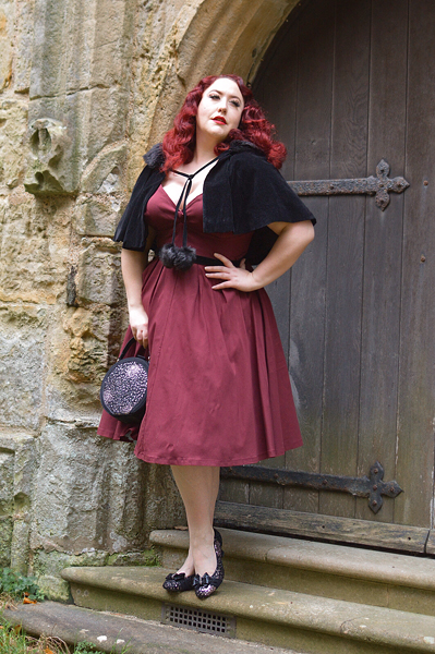 Pinup Miss Amy May models the black sequin Rhea low court heels and black sequin Alberta bag by Ruby Shoo for review