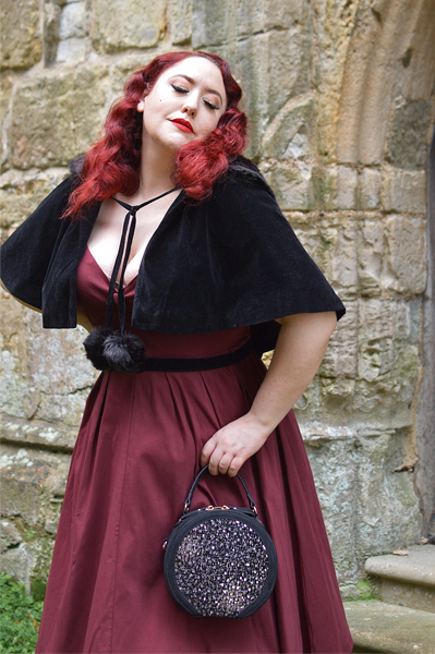 Pinup Miss Amy May models the black sequin Rhea low court heels and black sequin Alberta bag by Ruby Shoo for review