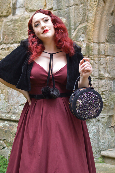 Pinup Miss Amy May models the black sequin Rhea low court heels and black sequin Alberta bag by Ruby Shoo for review