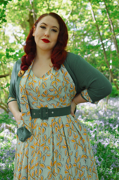 Plus size pinup Miss Amy May models the Kimmie-gia dress and Samira-Gia jacket by Miss Candyfloss for a fit and size freview