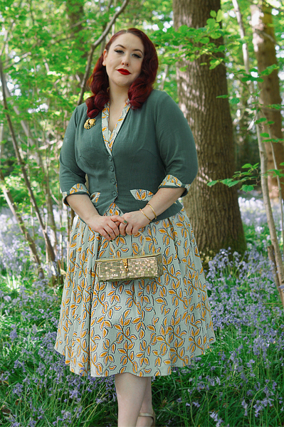 Plus size pinup Miss Amy May models the Kimmie-gia dress and Samira-Gia jacket by Miss Candyfloss for a fit and size freview