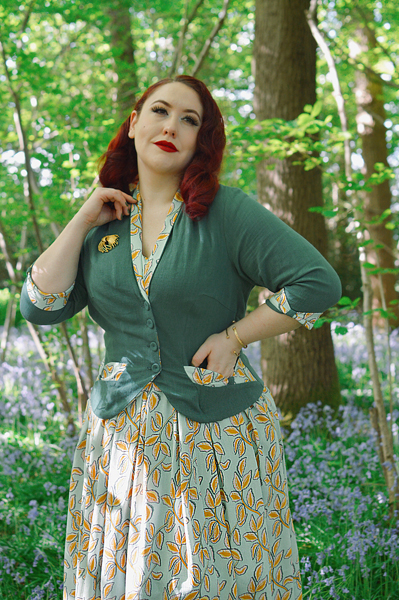 Plus size pinup Miss Amy May models the Kimmie-gia dress and Samira-Gia jacket by Miss Candyfloss for a fit and size freview